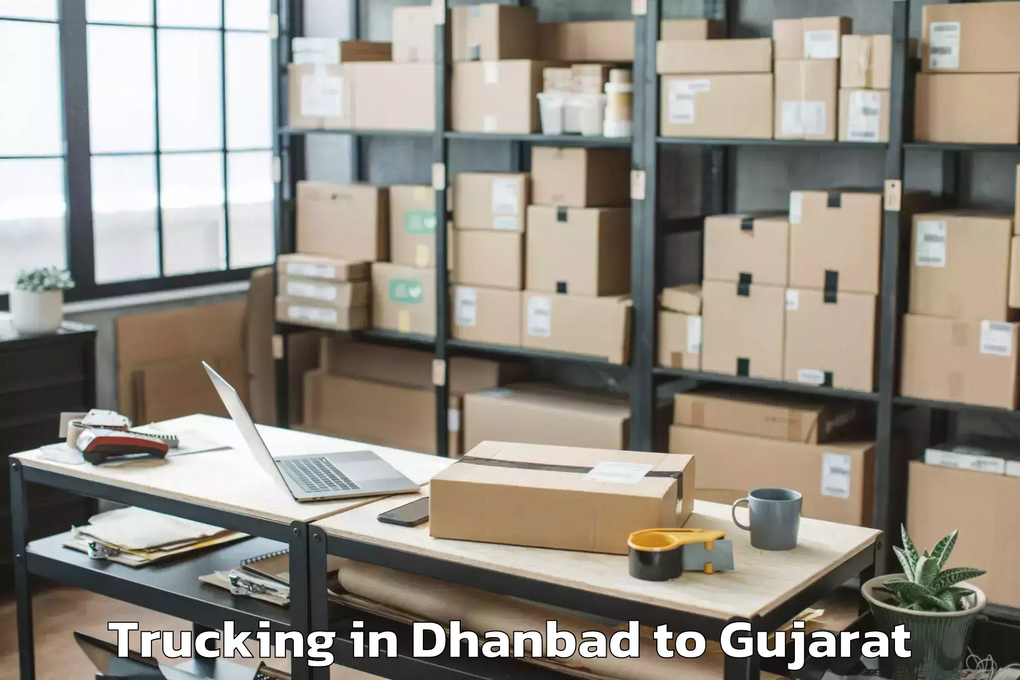 Affordable Dhanbad to Porbandar Airport Pbd Trucking